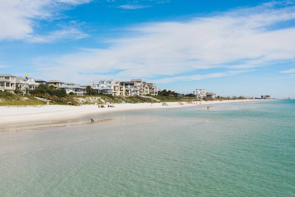 Beautiful blue sandy beach with stately beach homes in the background near Rosemary Beach, Florida (FL)